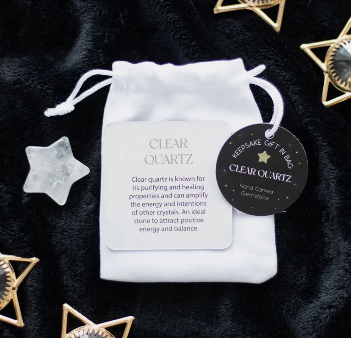Clear quartz star in velvet bag